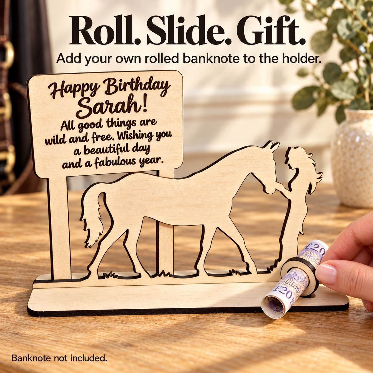 Hand adding a rolled banknote to the wooden ring on the personalised horse money holder