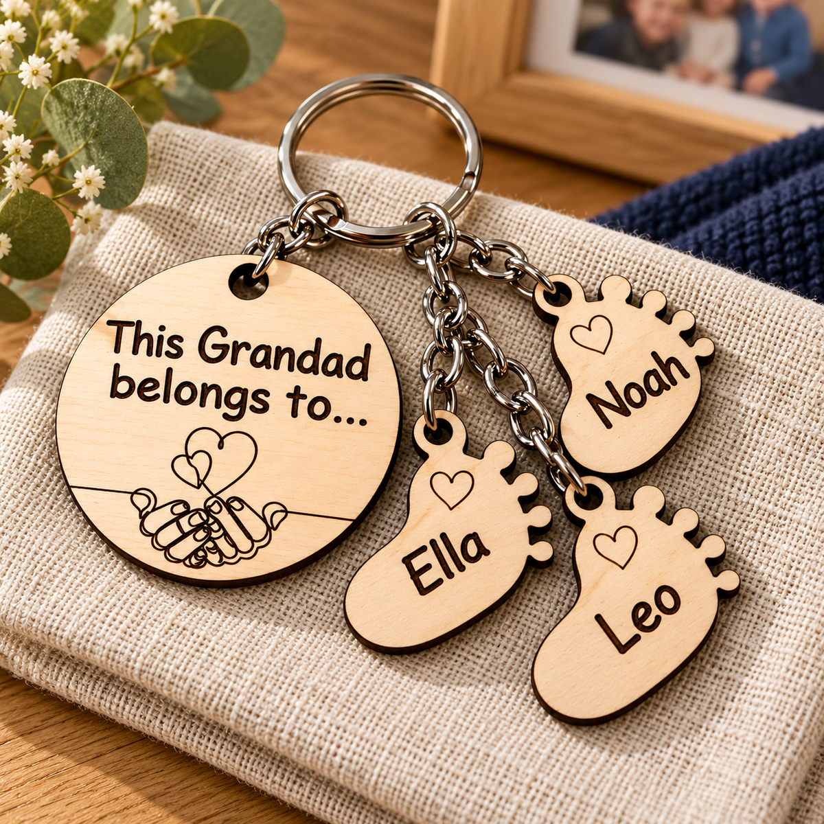 This Grandad belongs to personalised wooden keyring with Noah, Ella and Leo footprint charms and dark engraved hearts.