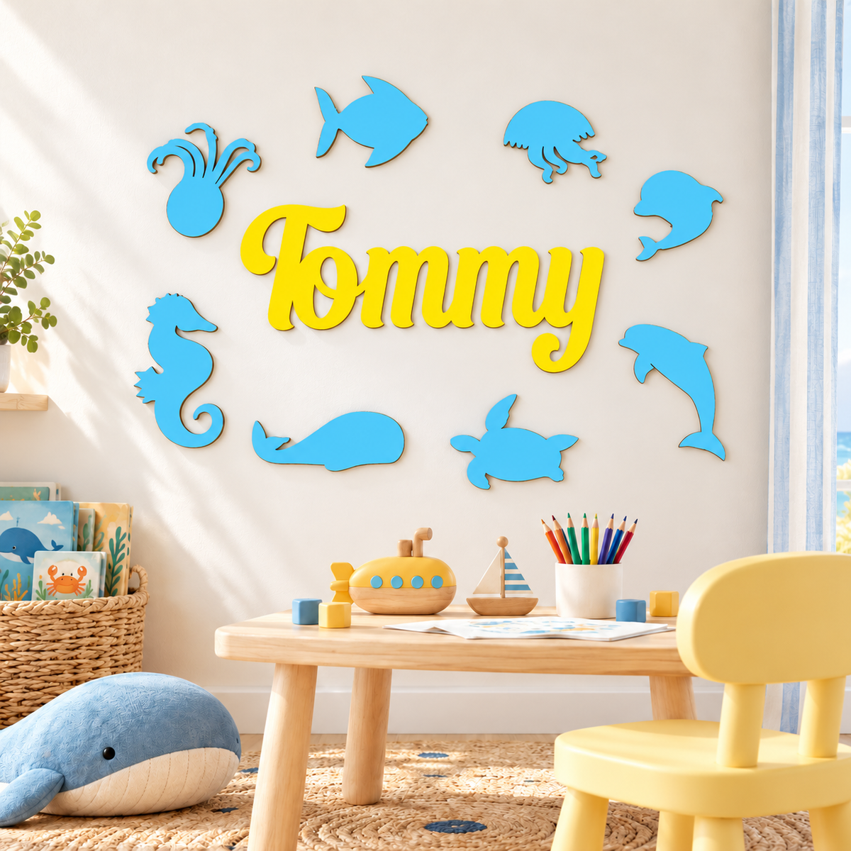 Yellow Tommy wooden name with eight Pastel Blue sea animals styled in a children's room