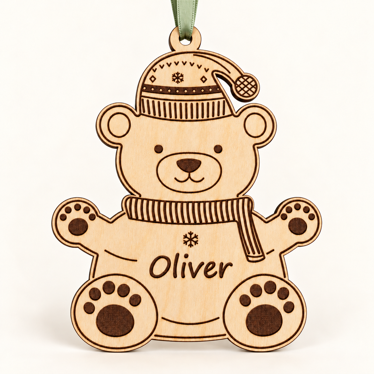 Full front view of the personalised Oliver polar bear bauble with a sage green ribbon against an ivory background.