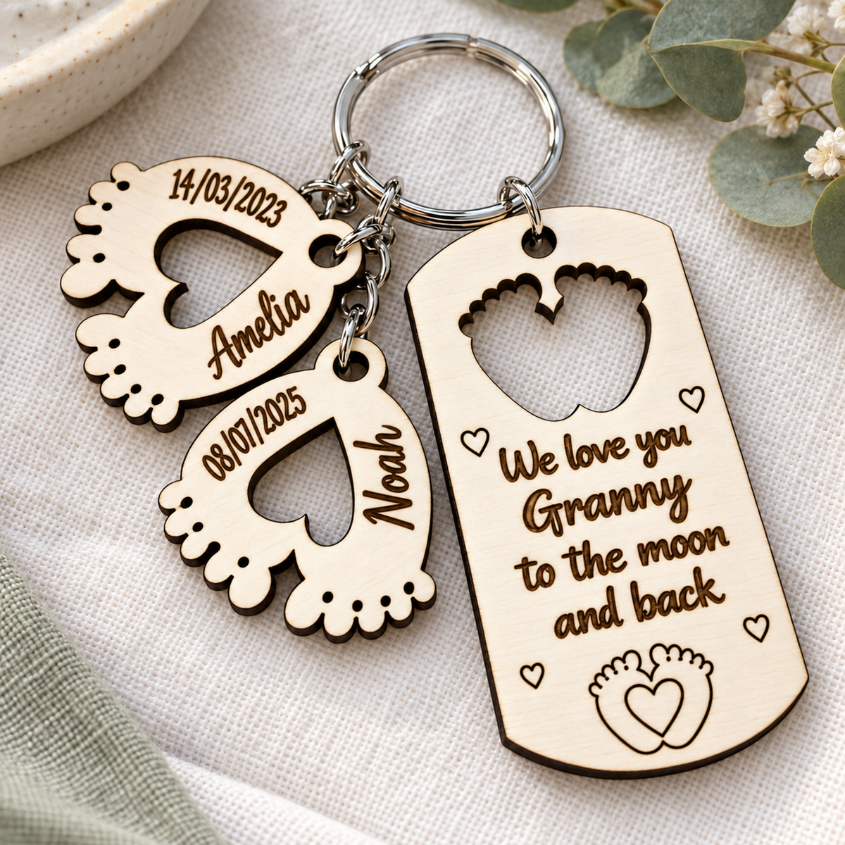 Personalised Granny keyring engraved We love you Granny to the moon and back, with two child charms.