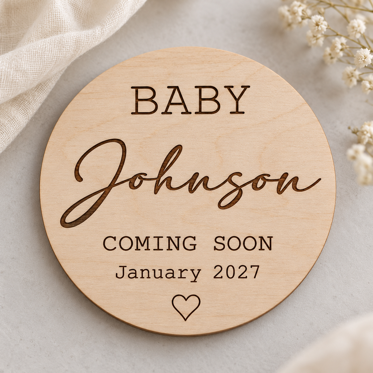 Round birch wood Coming Soon plaque with surname, due date and small engraved heart