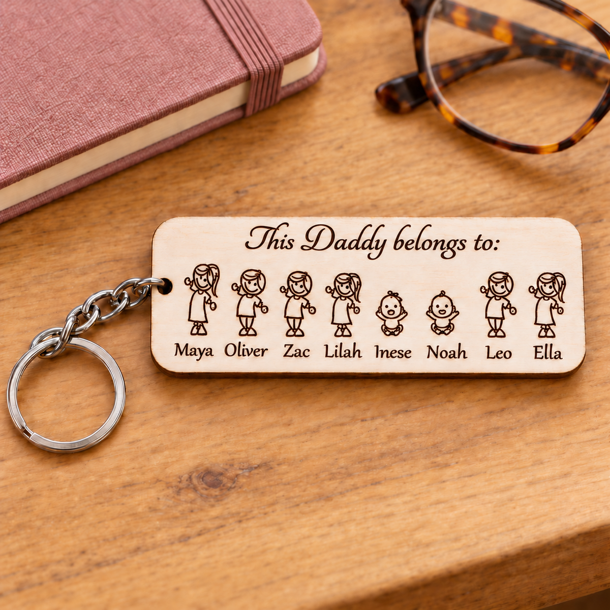 This Daddy belongs to personalised keyring showing eight engraved children and names