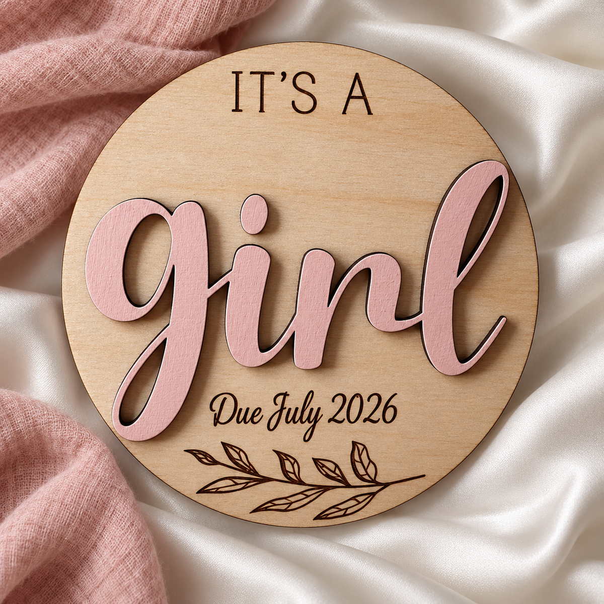 It's a Girl wooden gender reveal plaque on ivory satin, with Due July 2026 engraving