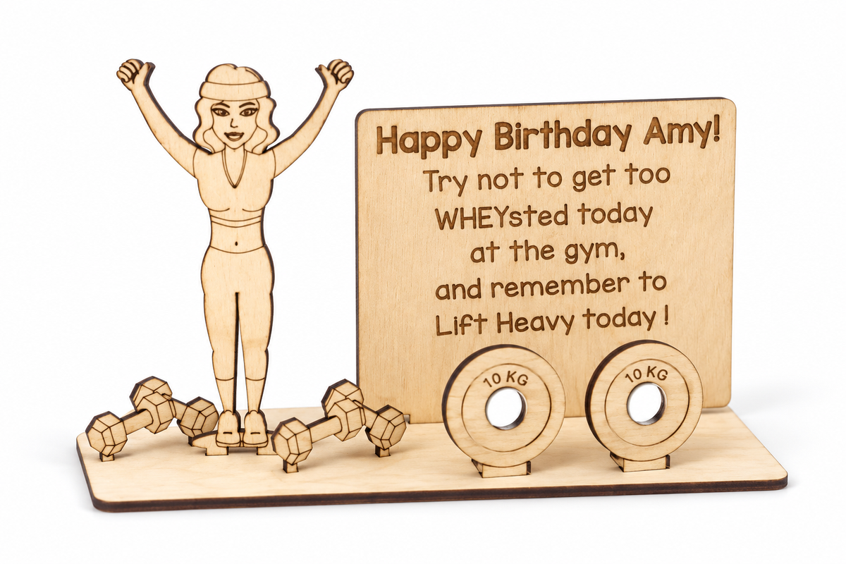 Wooden gym money holder without a banknote, showing the female figure, message plaque and empty weight plate holes