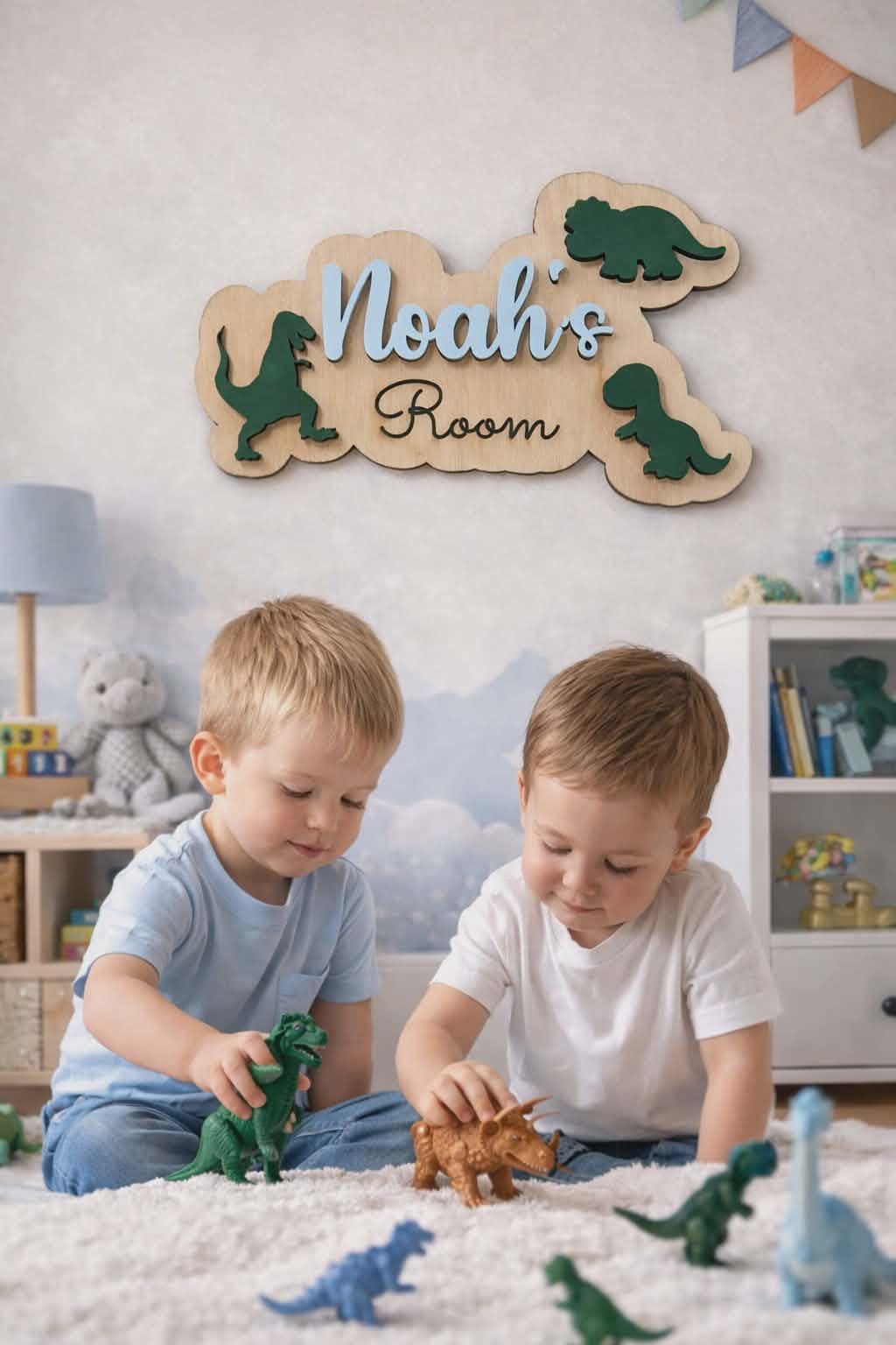 Dinosaur name sign on nursery wall with kids playing on floor.