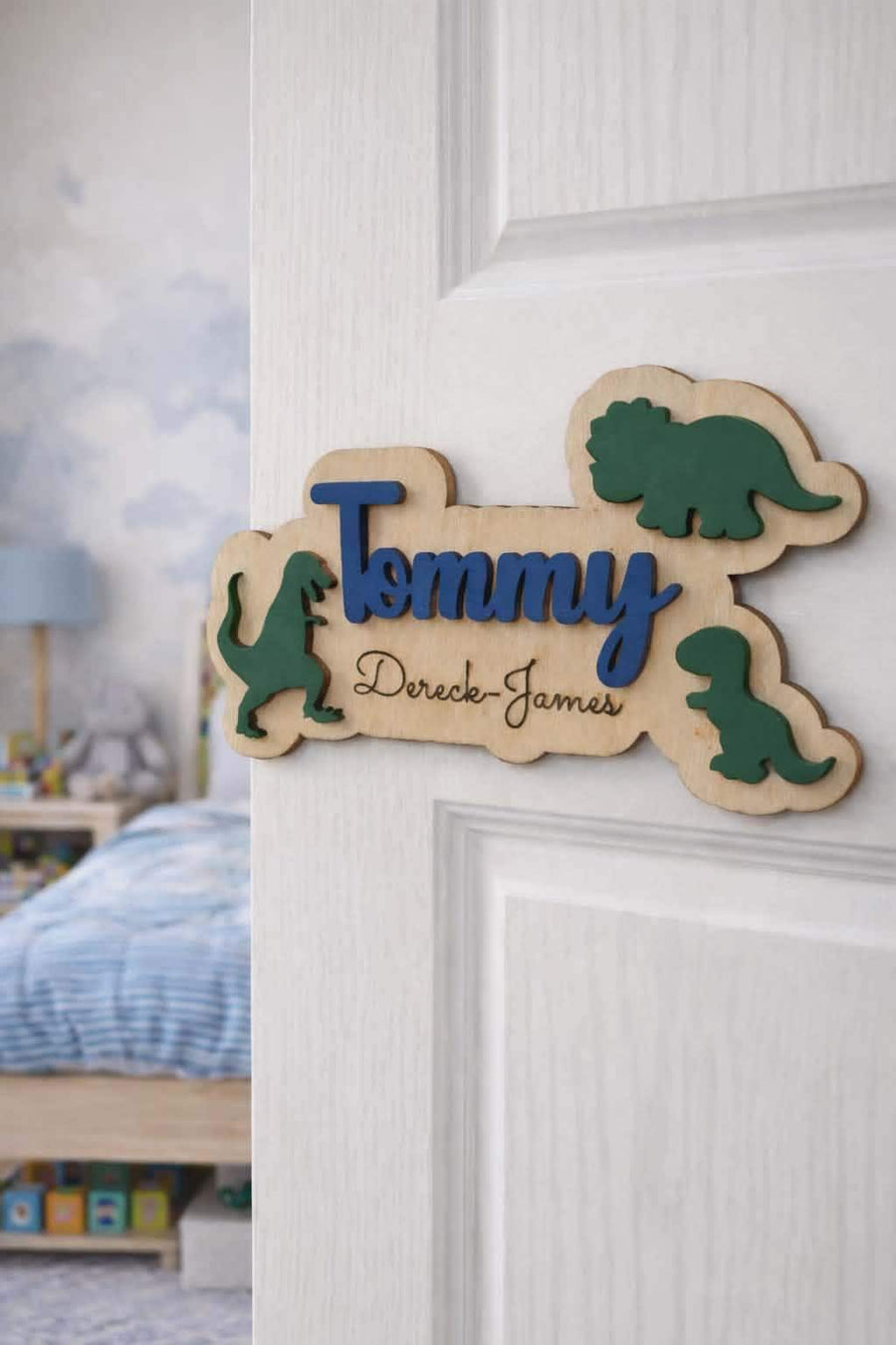 Personalised dinosaur name sign on kids bedroom door.