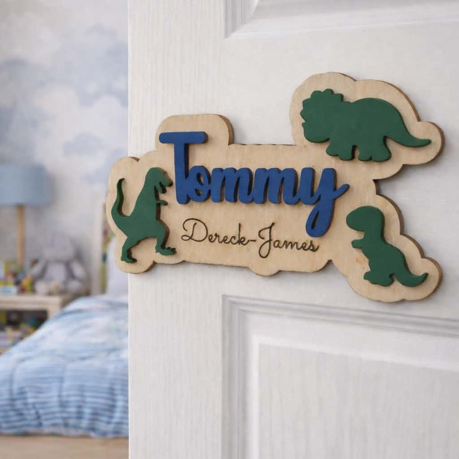 Personalised dinosaur name sign on kids bedroom door.