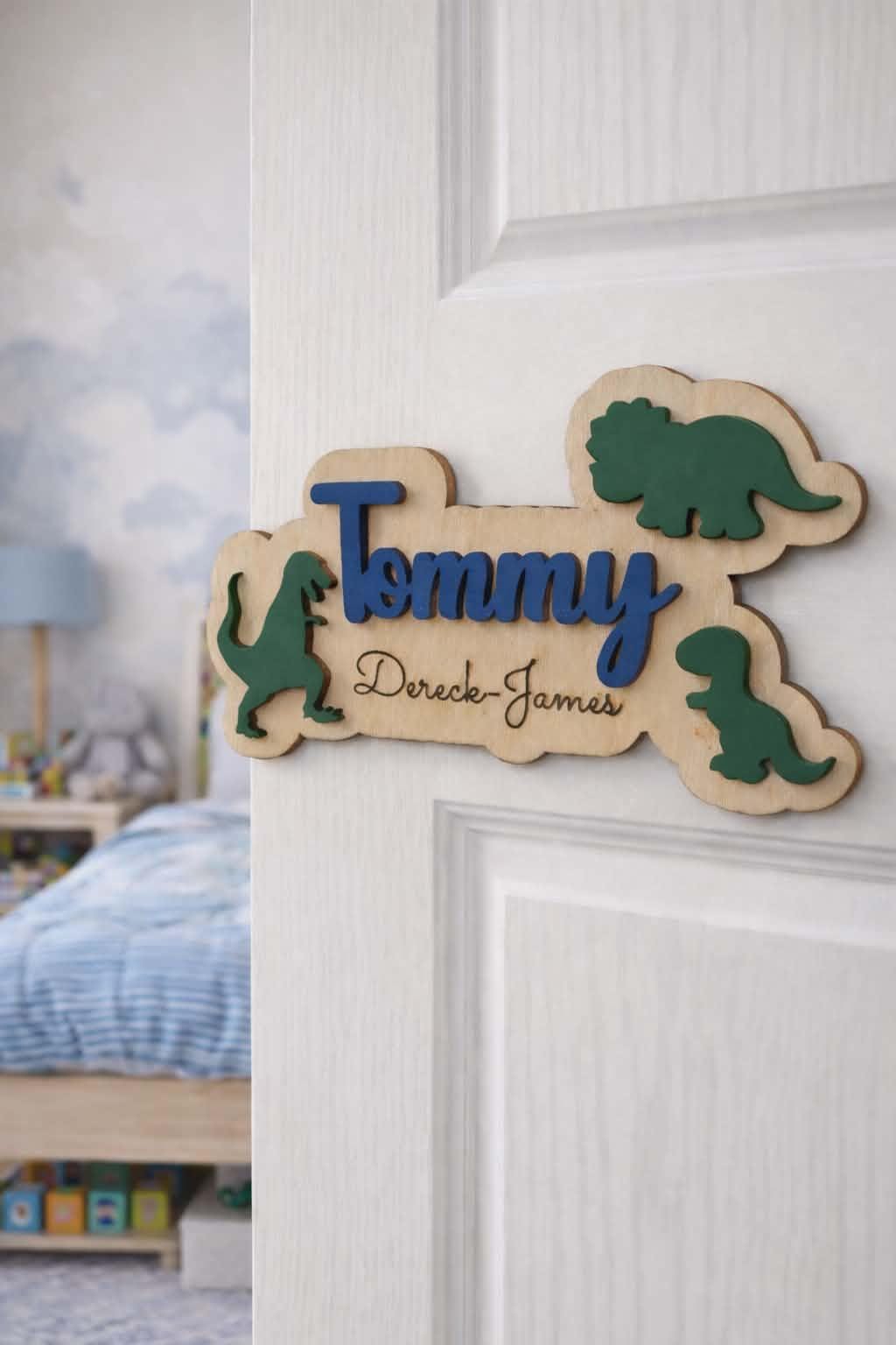 Personalised dinosaur name sign on kids bedroom door.