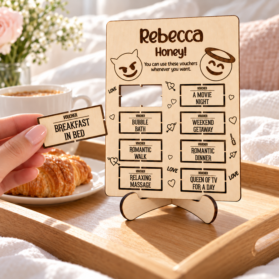 Breakfast in bed voucher removed from a wooden love coupon card, with an open cut-out