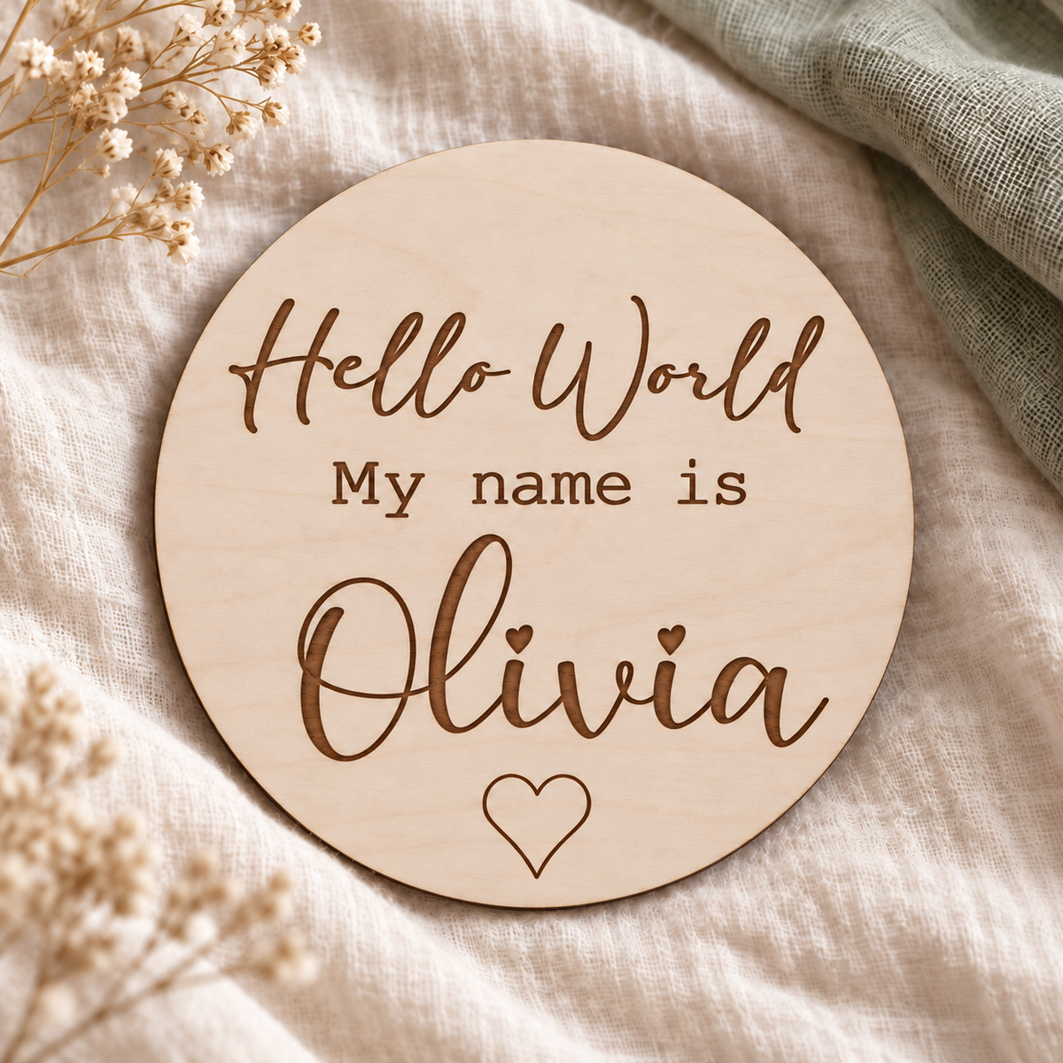Hello World My name is Olivia wooden name card with script lettering and an engraved outline heart
