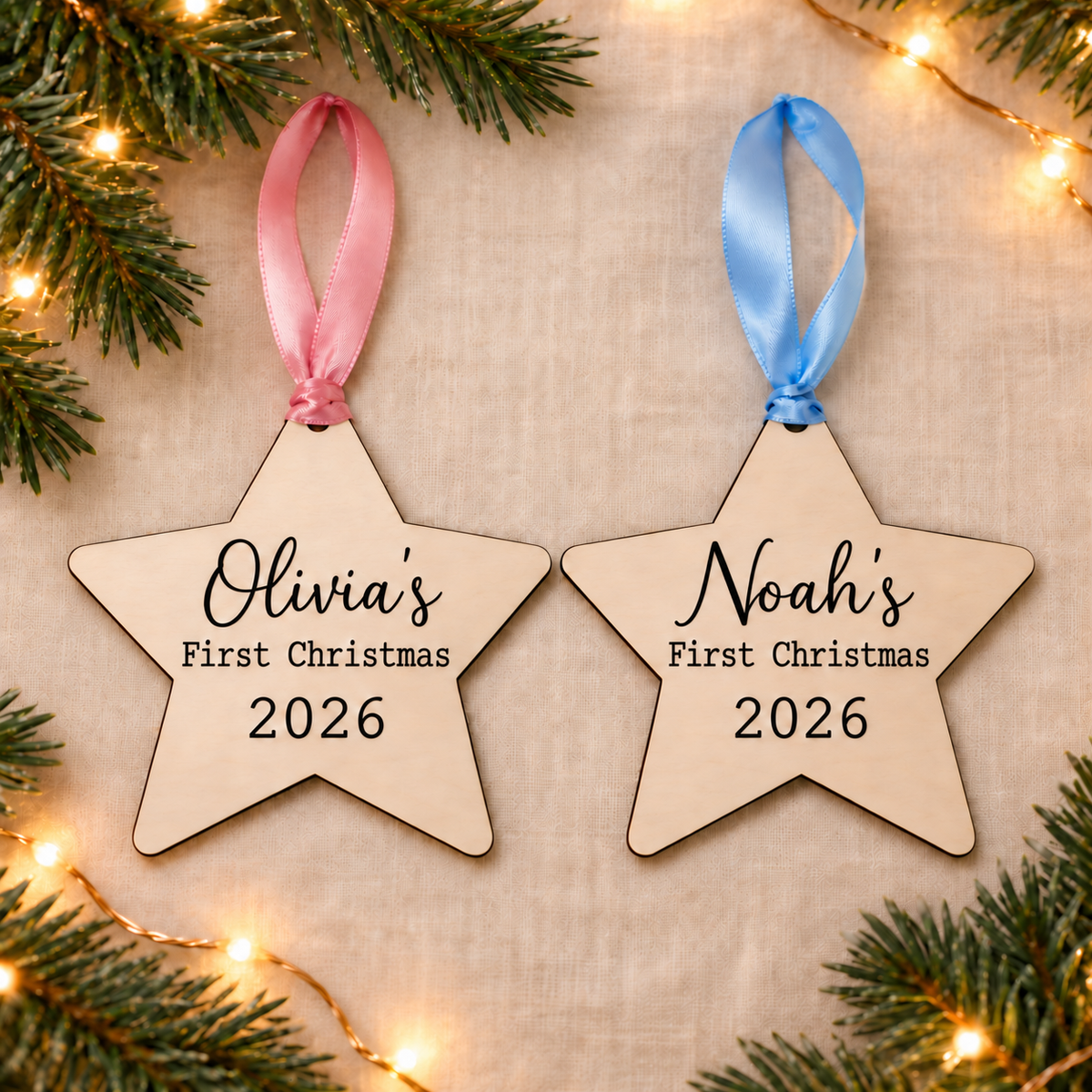 Personalised first Christmas wooden star baubles with Olivia and Noah names, 2026, and pink or blue ribbon