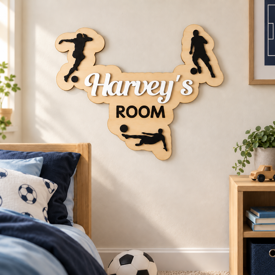 White Harvey’s ROOM wooden football name plaque displayed on a child's bedroom wall with three black player silhouettes.
