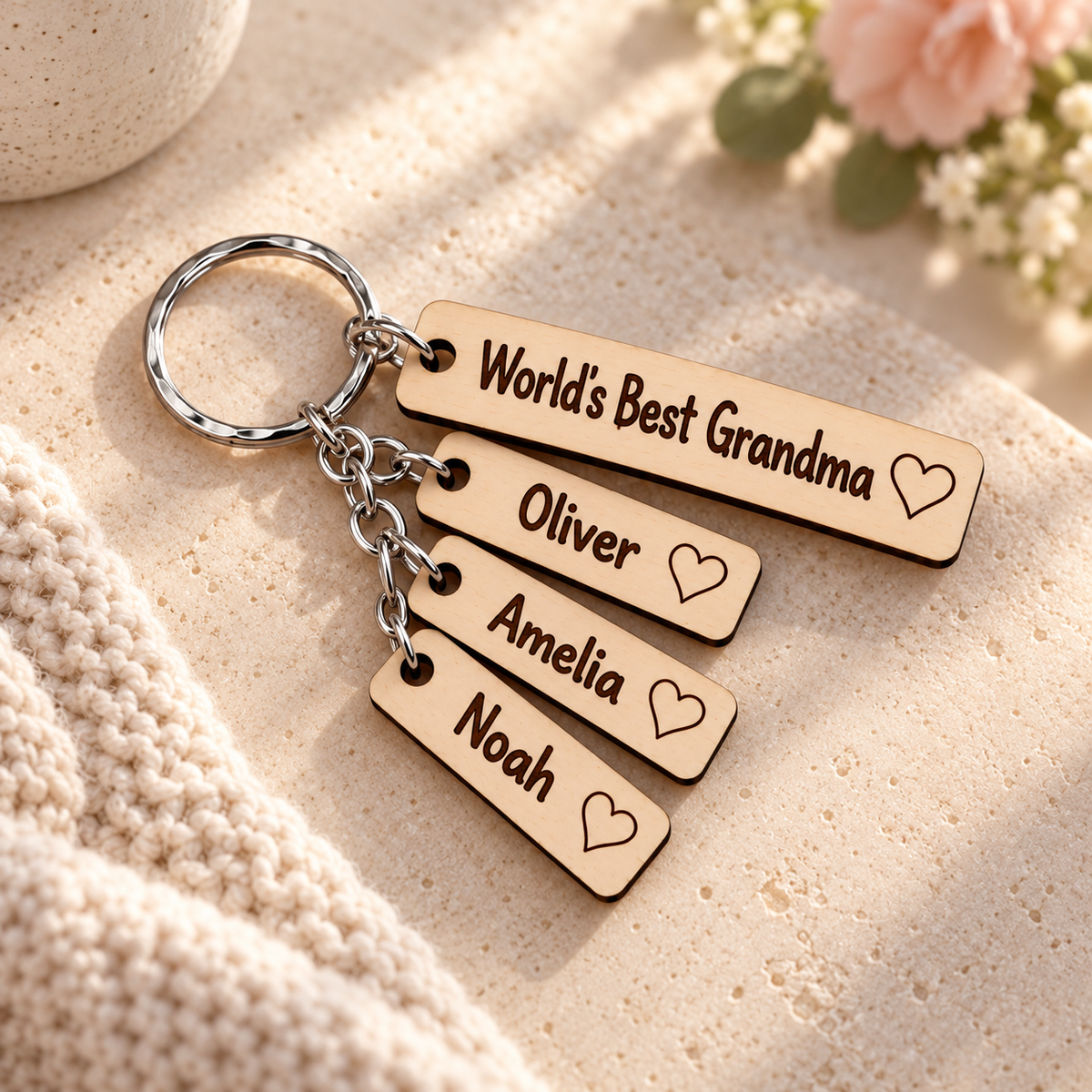 World's Best Grandma wooden keyring with Oliver, Amelia and Noah engraved name charms.