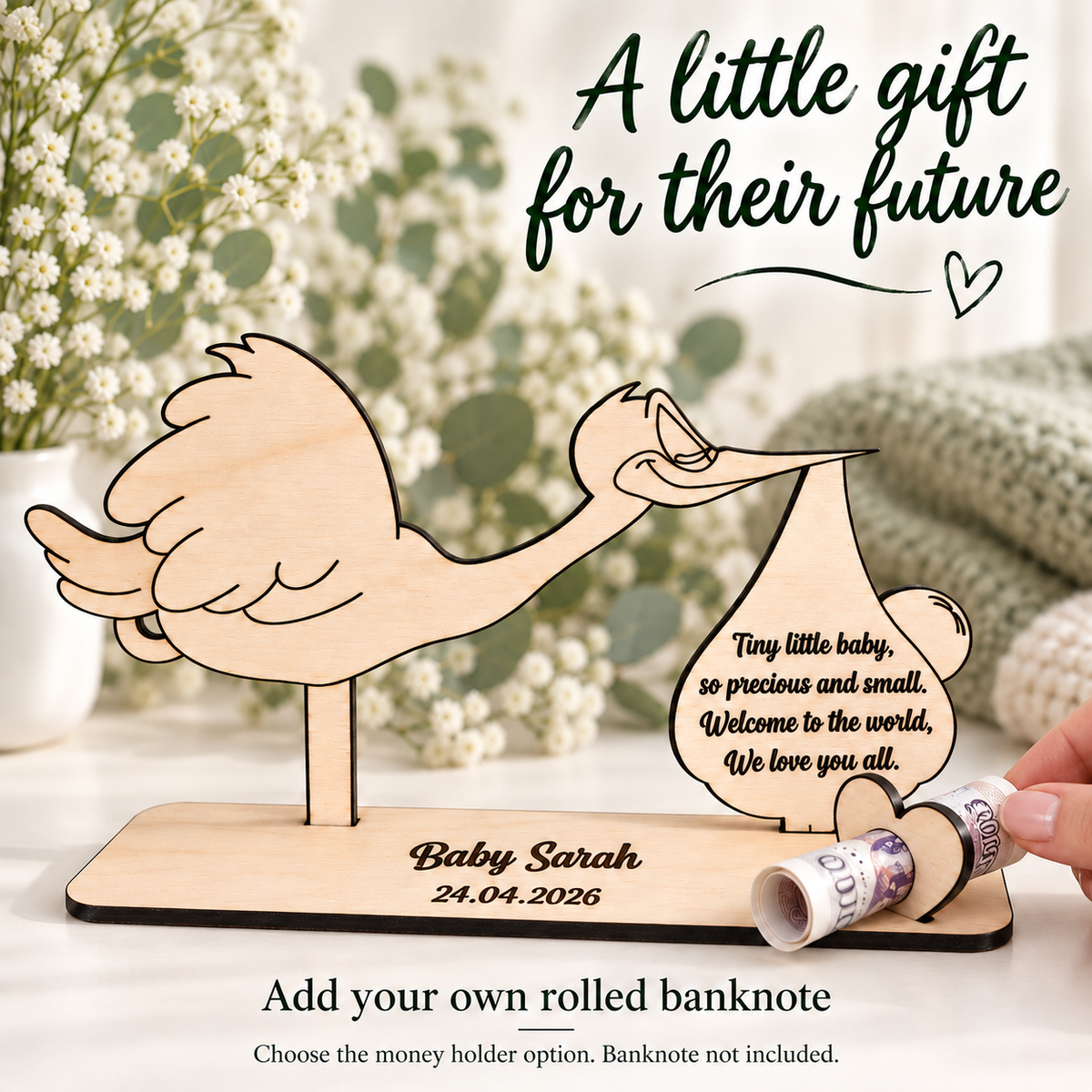 Wooden stork money holder with a hand adding a rolled banknote; banknote not included