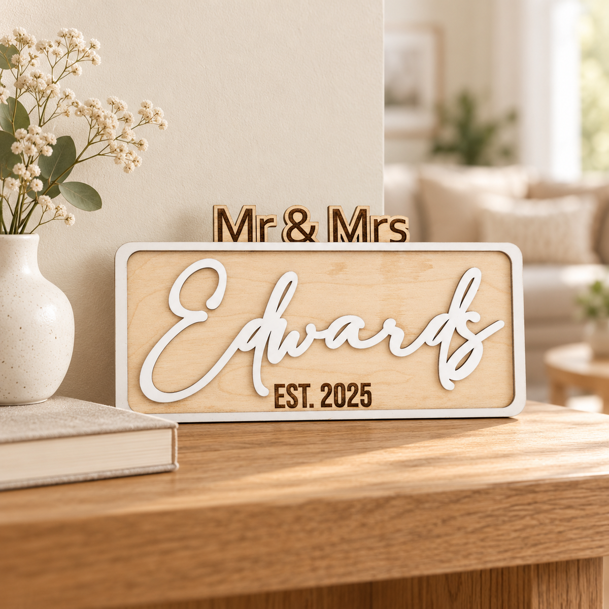 White personalised Mr & Mrs Edwards sign displayed as a wedding keepsake on a home console