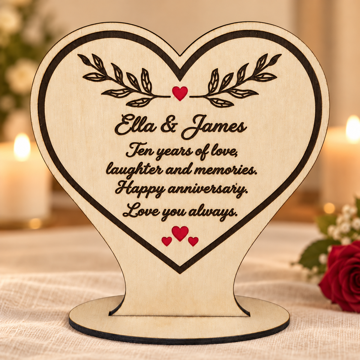 Freestanding engraved wooden heart with Ella and James anniversary message