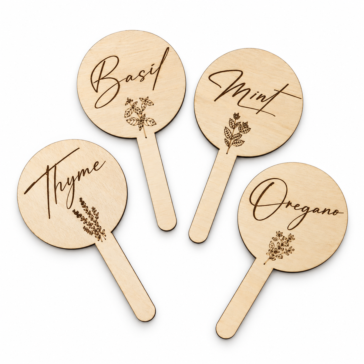 Basil, Mint, Oregano and Thyme wooden plant markers on a white background
