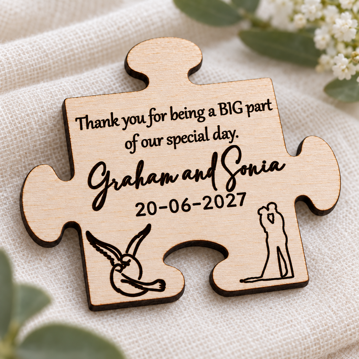 Close-up of dark laser engraving and natural birch wood grain on a personalised puzzle wedding magnet.