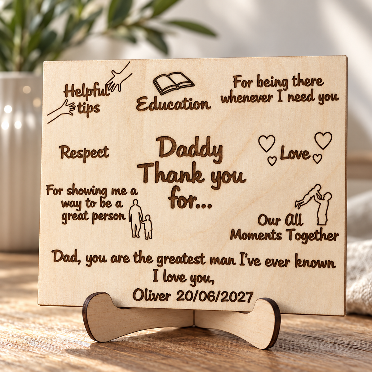 Close-up of dark engraved lettering and natural birch grain on a personalised card for Dad