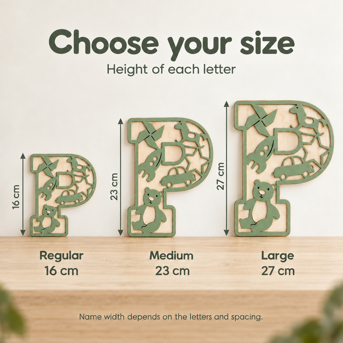 Size comparison of wooden name letters showing heights of 16 cm, 23 cm and 27 cm per letter