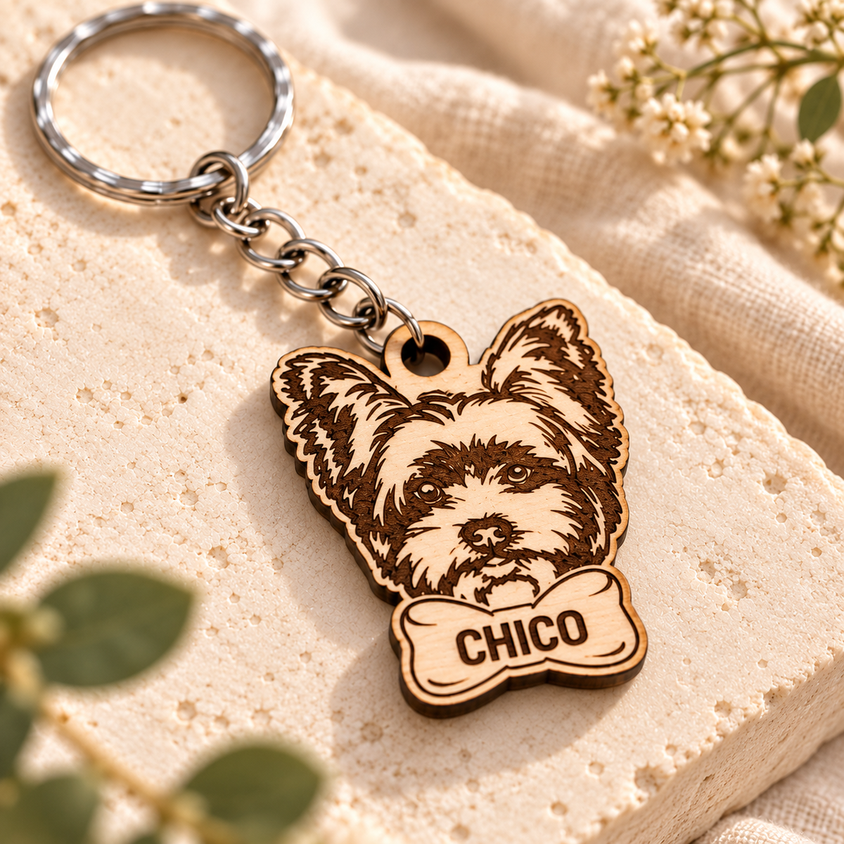 Close-up of CHICO wooden Yorkshire Terrier keyring showing laser engraved fur detail and natural birch wood edge