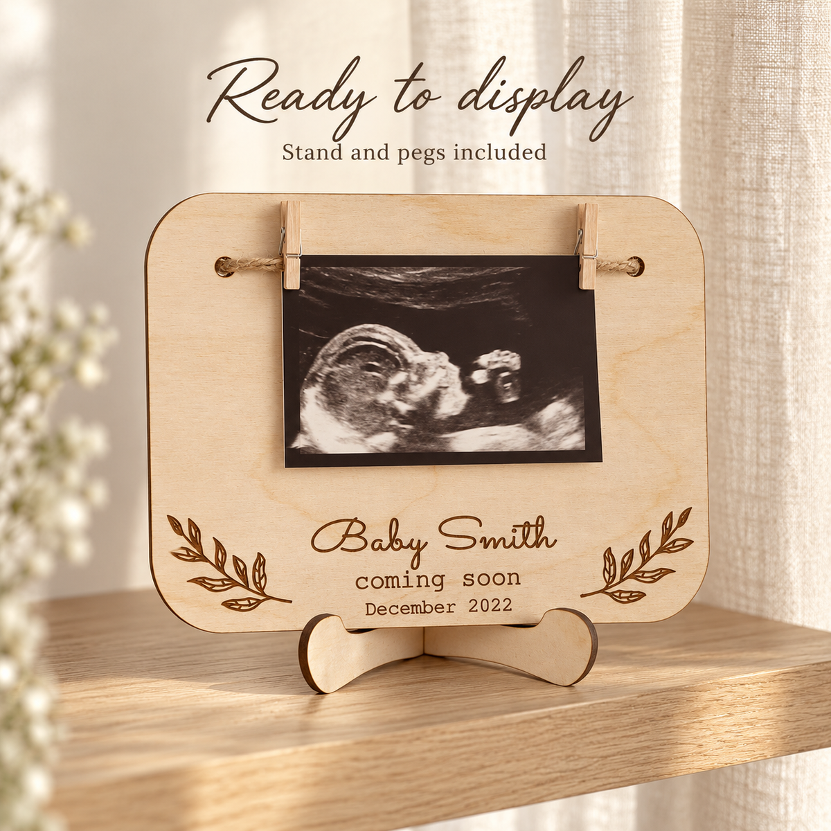 Pregnancy announcement sign on the included wooden stand with pegs