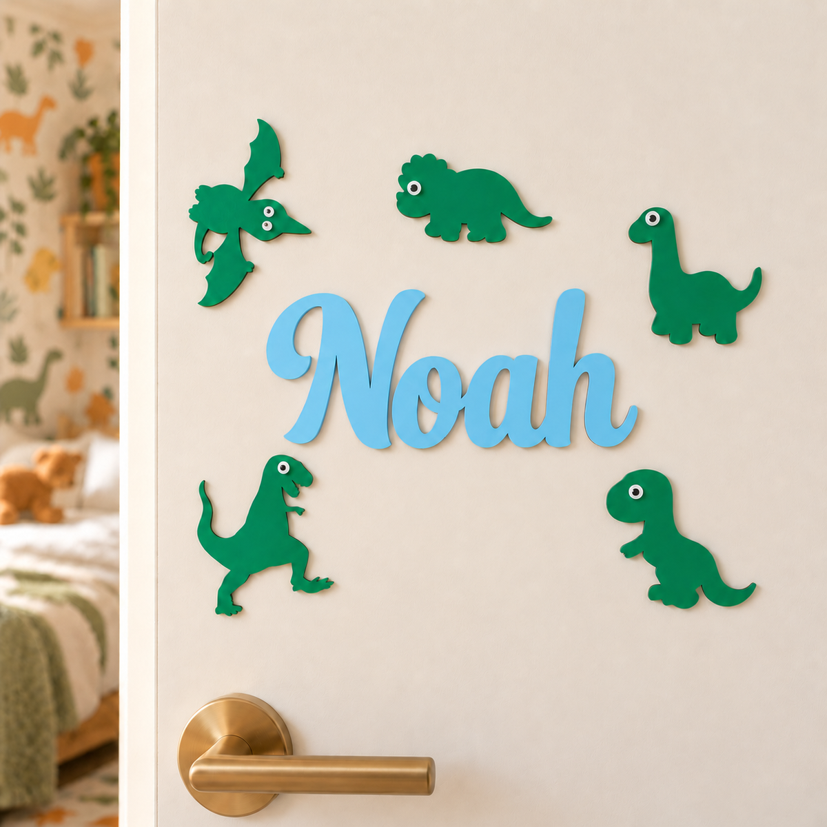 Pastel blue Noah wooden name and five separate green dinosaur decorations on a bedroom door