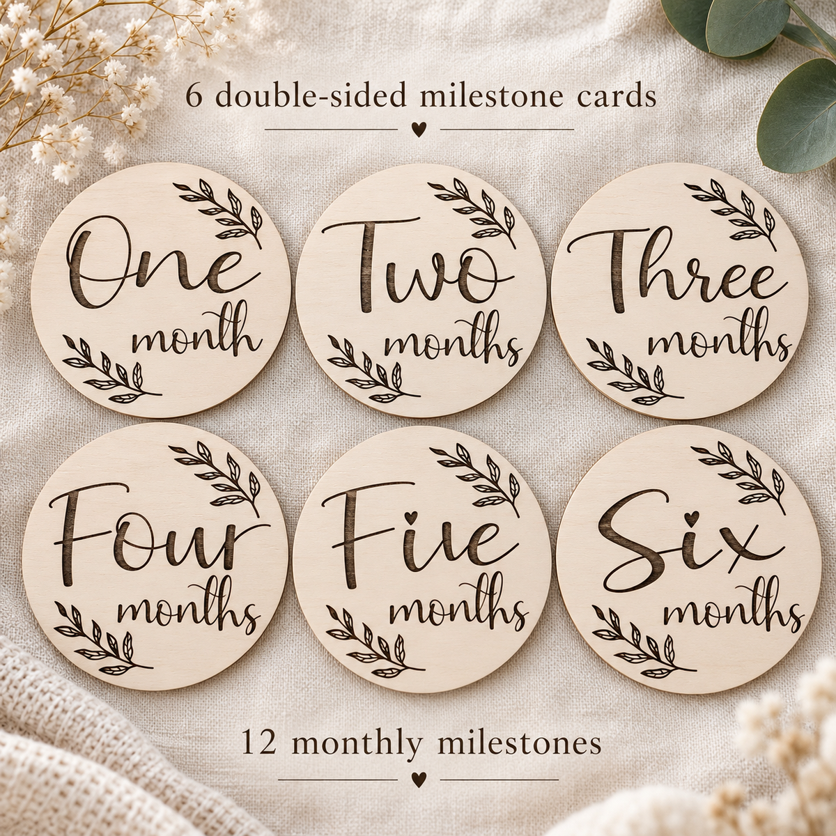 Six double-sided wooden milestone cards showing months one to six