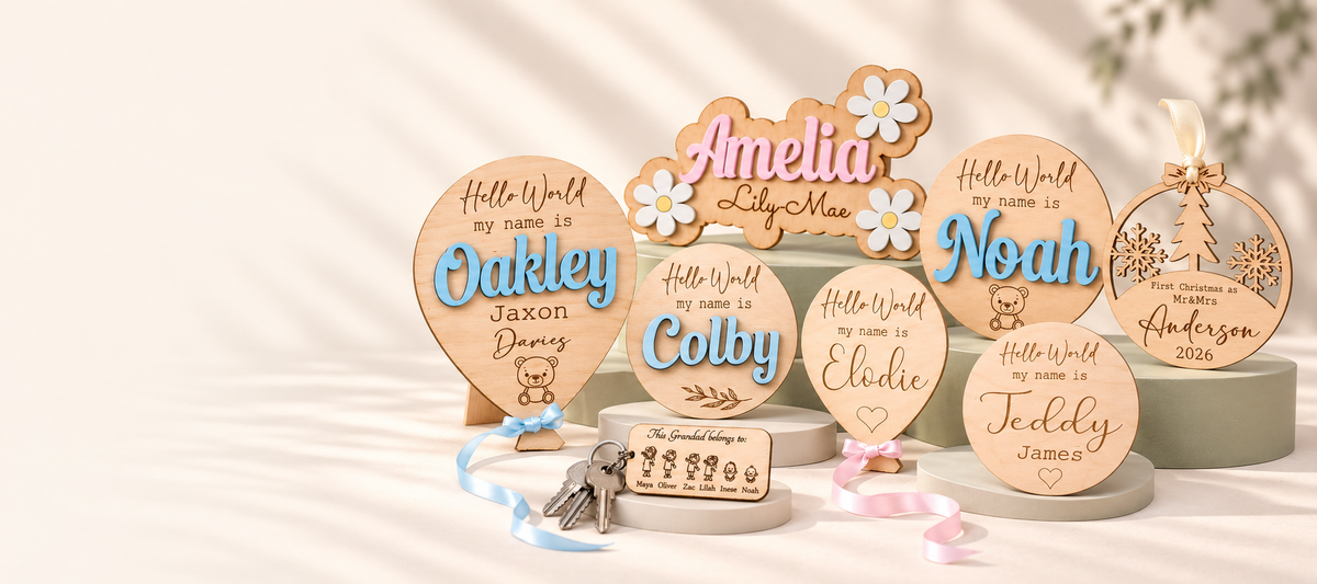 Eight customer favourites: Oakley blue balloon name plaque, Grandad family keyring, Noah teddy name disc, Amelia and Lily-Mae daisy name sign, Elodie balloon name plaque, Colby round name disc, Teddy James engraved name disc, and Anderson first Christmas married bauble.