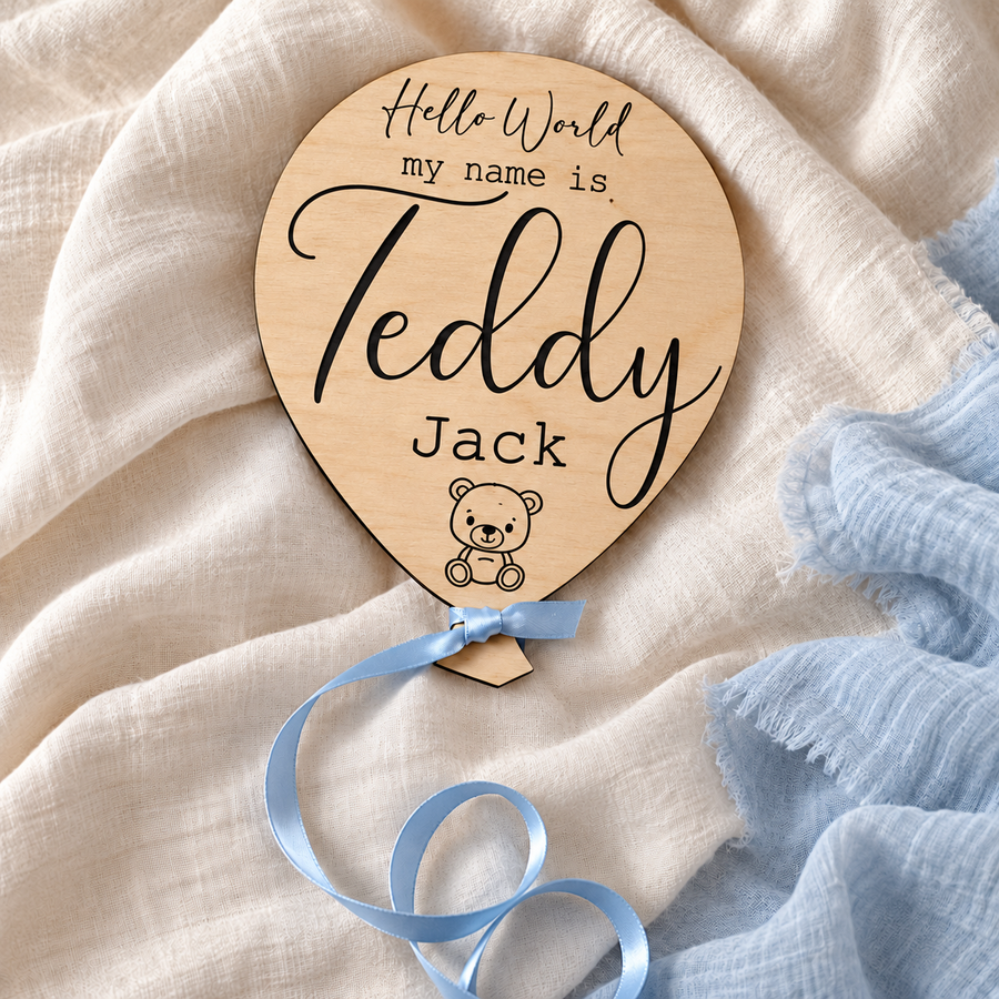 Teddy Jack wooden baby name plaque with dark engraved lettering on ivory linen