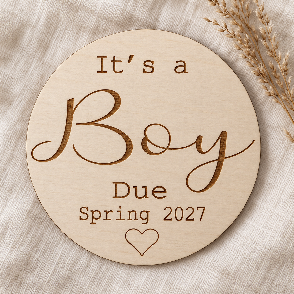 It's a Boy engraved wooden gender reveal sign with Spring 2027 due date on ivory linen