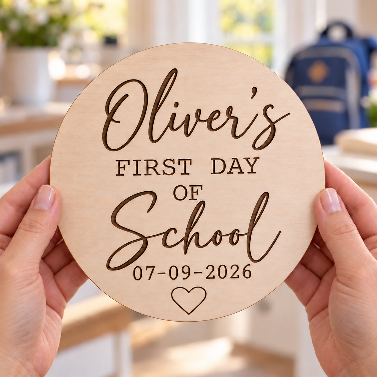 Oliver’s first day of School engraved wooden sign held in adult hands