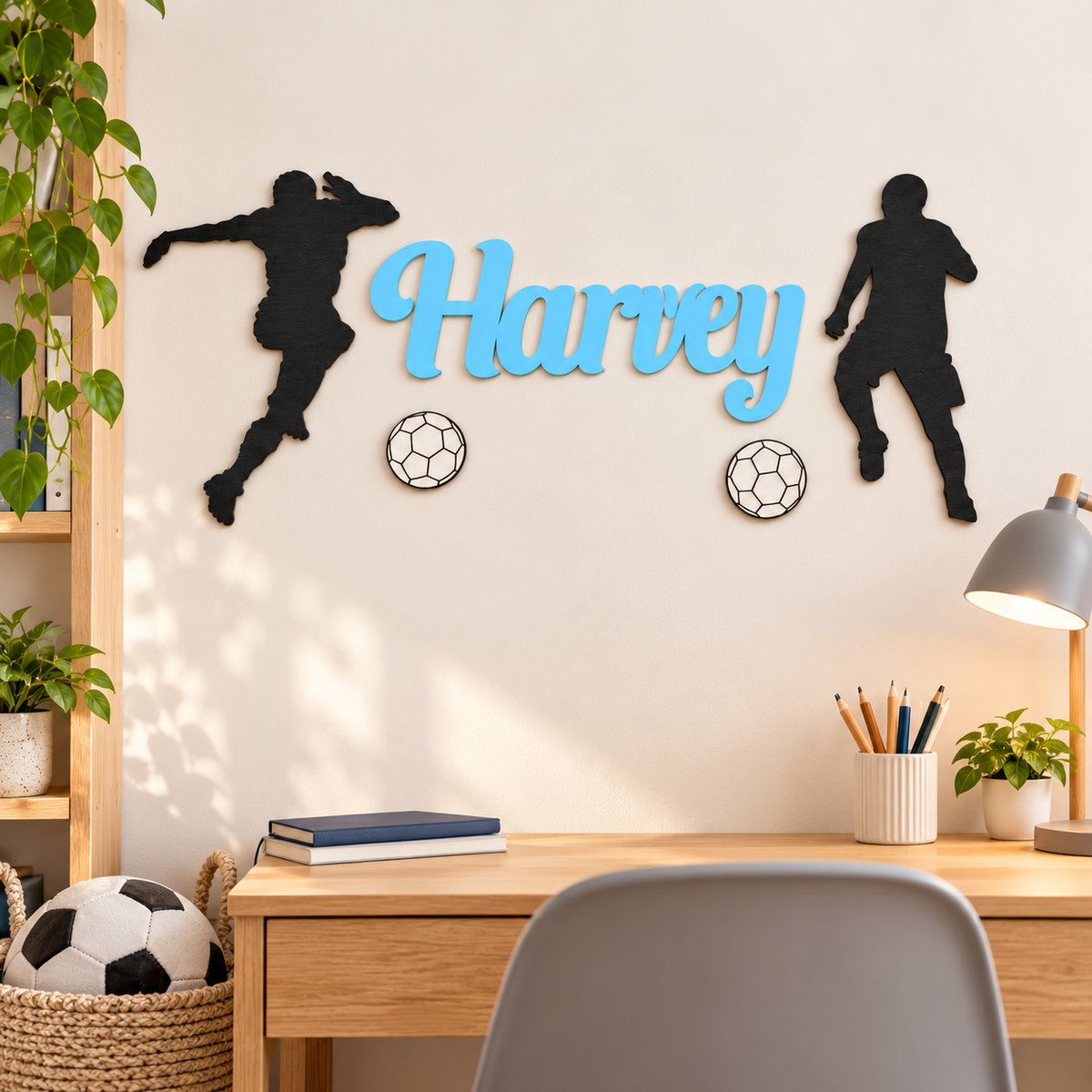 Personalised football wall decor set with Pastel Blue Harvey lettering displayed above an oak study desk.