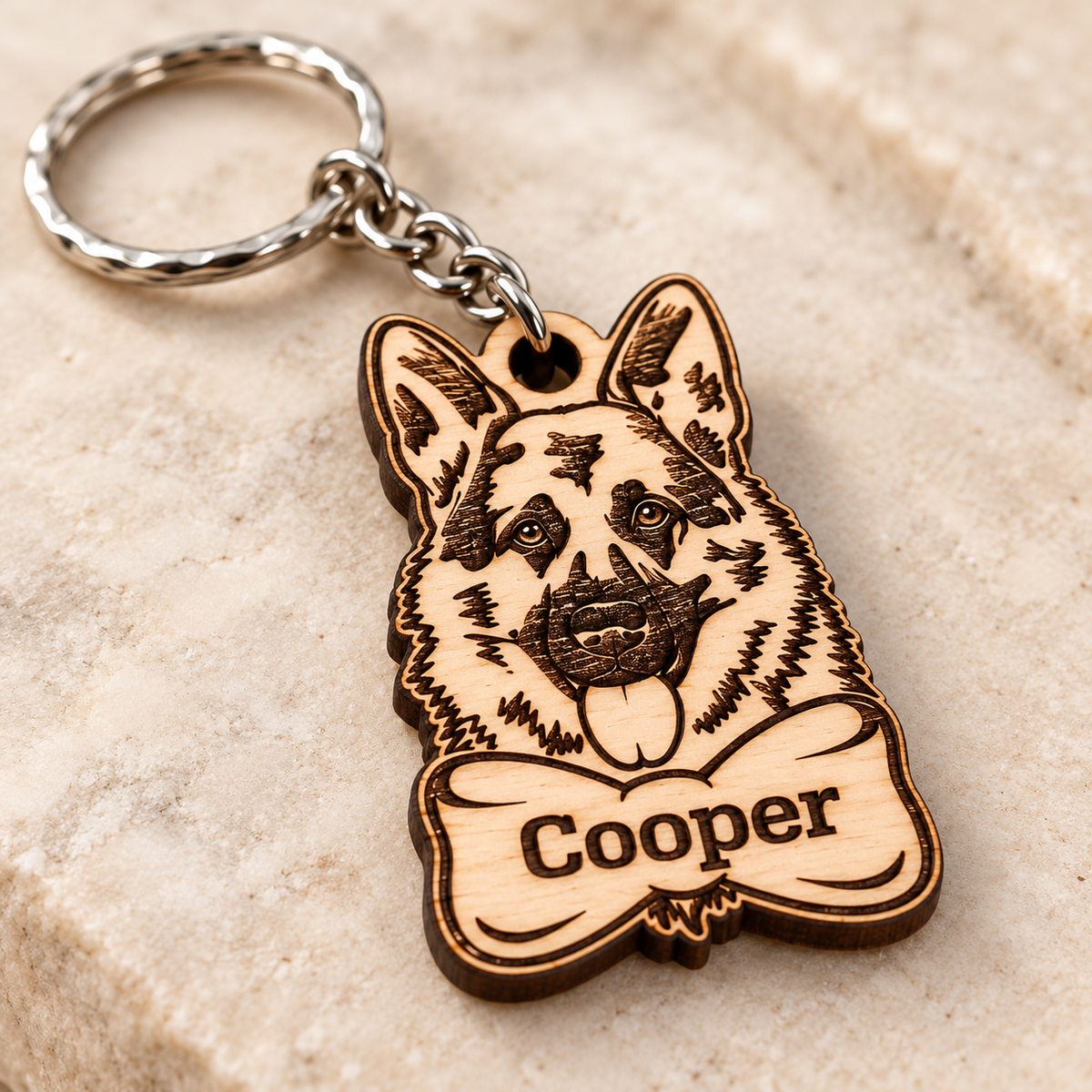 Close-up of the dark laser engraved German Shepherd illustration and personalised Cooper name on birch plywood