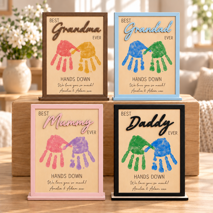 Four personalised handprint frames for Grandma, Grandad, Mummy and Daddy in brown, pastel blue, pastel pink and black.
