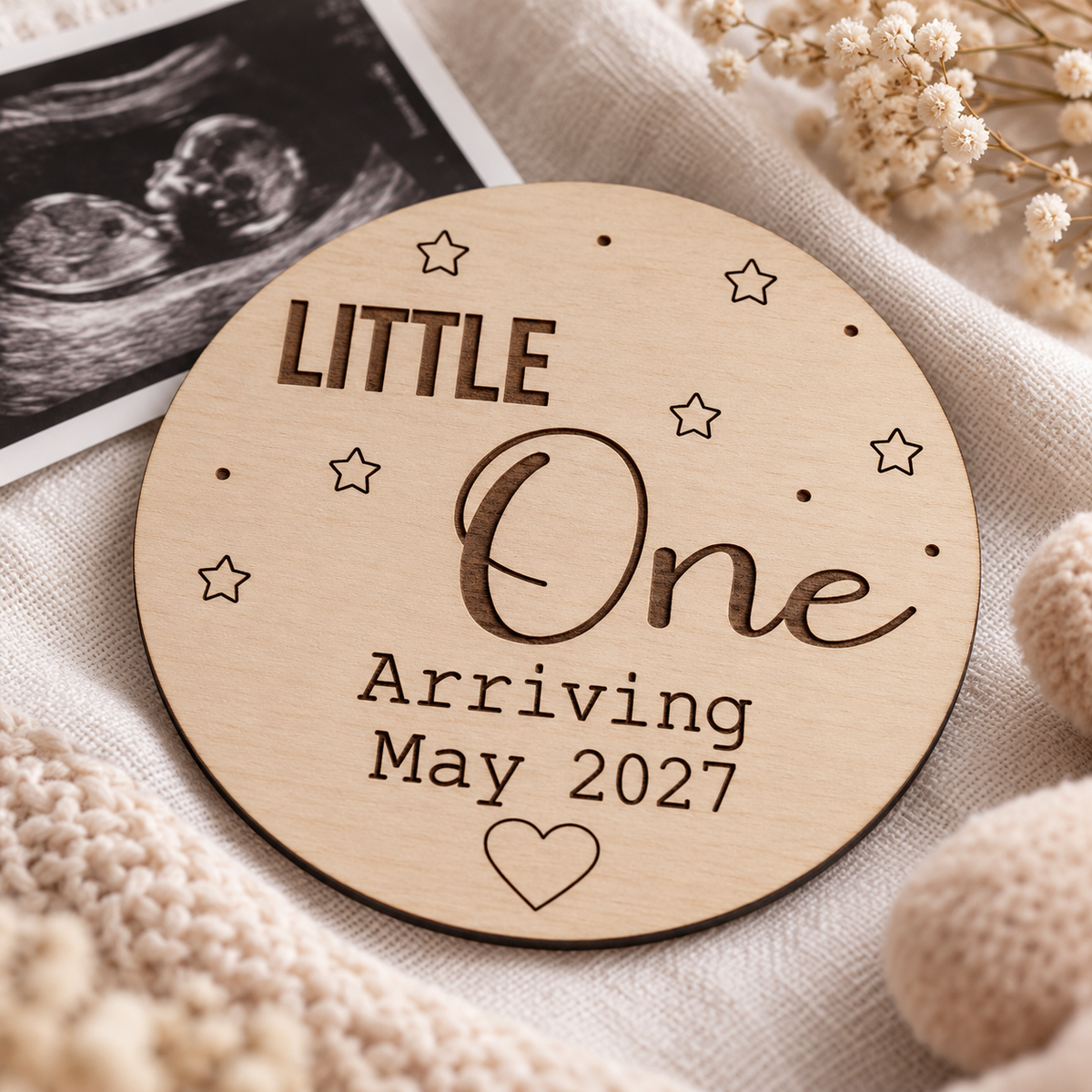 Close-up of the engraved Little One wording, stars and thin birch plywood edge