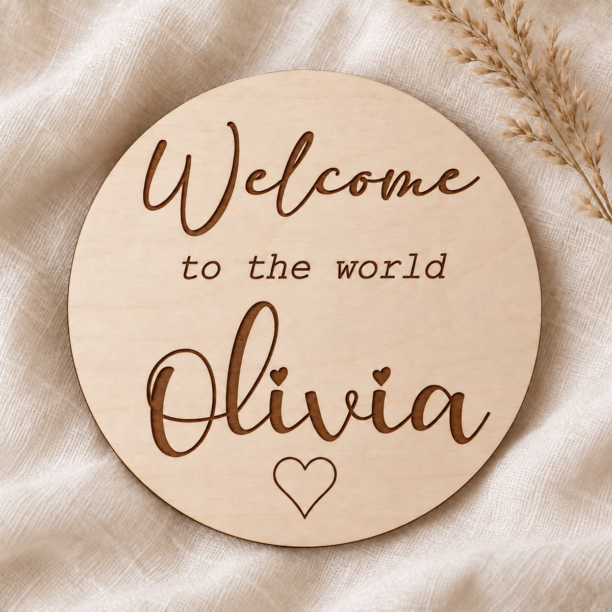 Welcome to the world Olivia personalised round wooden card with engraved script lettering and outline heart