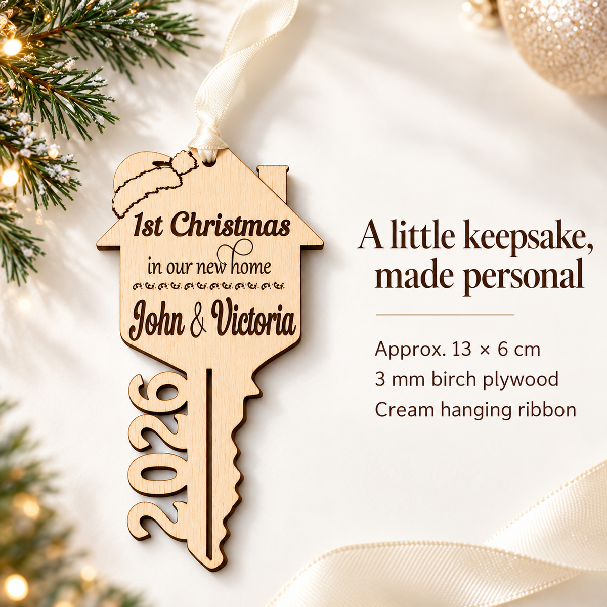 First Christmas in new home key bauble showing approximate 13 by 6 cm size, 3 mm birch plywood and cream hanging ribbon