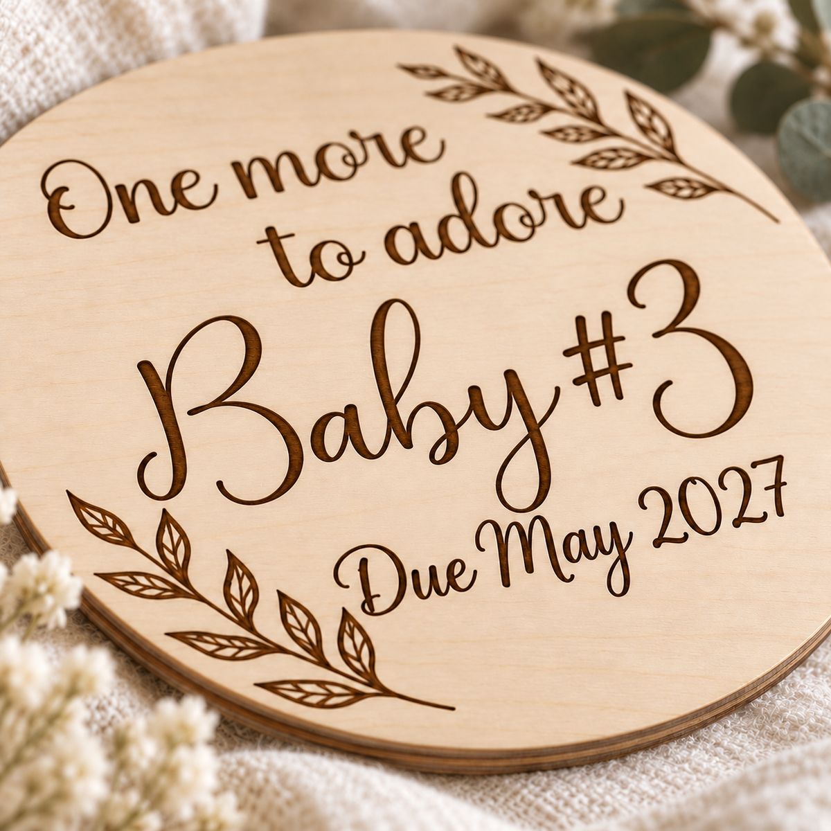 Close-up of baby number engraving and natural birch plywood edge