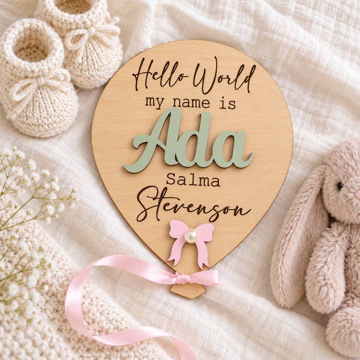 Sage Green raised Ada name on a natural wooden balloon plaque with pink ribbon.