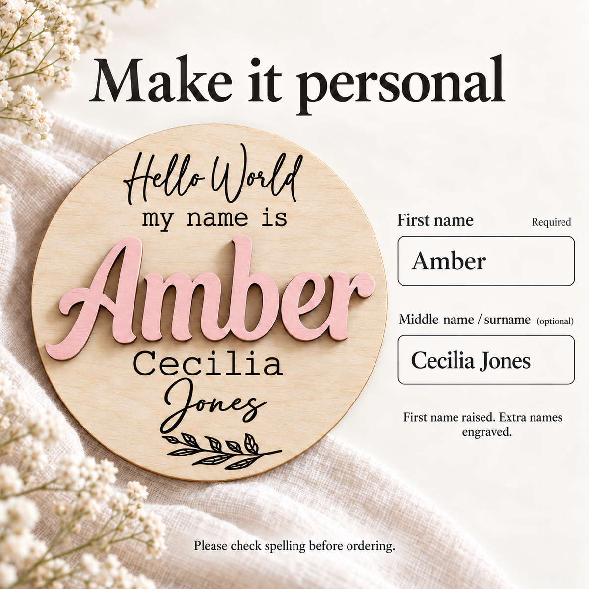 Baby name disc personalisation example: Amber raised in Pastel Pink, with optional Cecilia Jones engraved below.