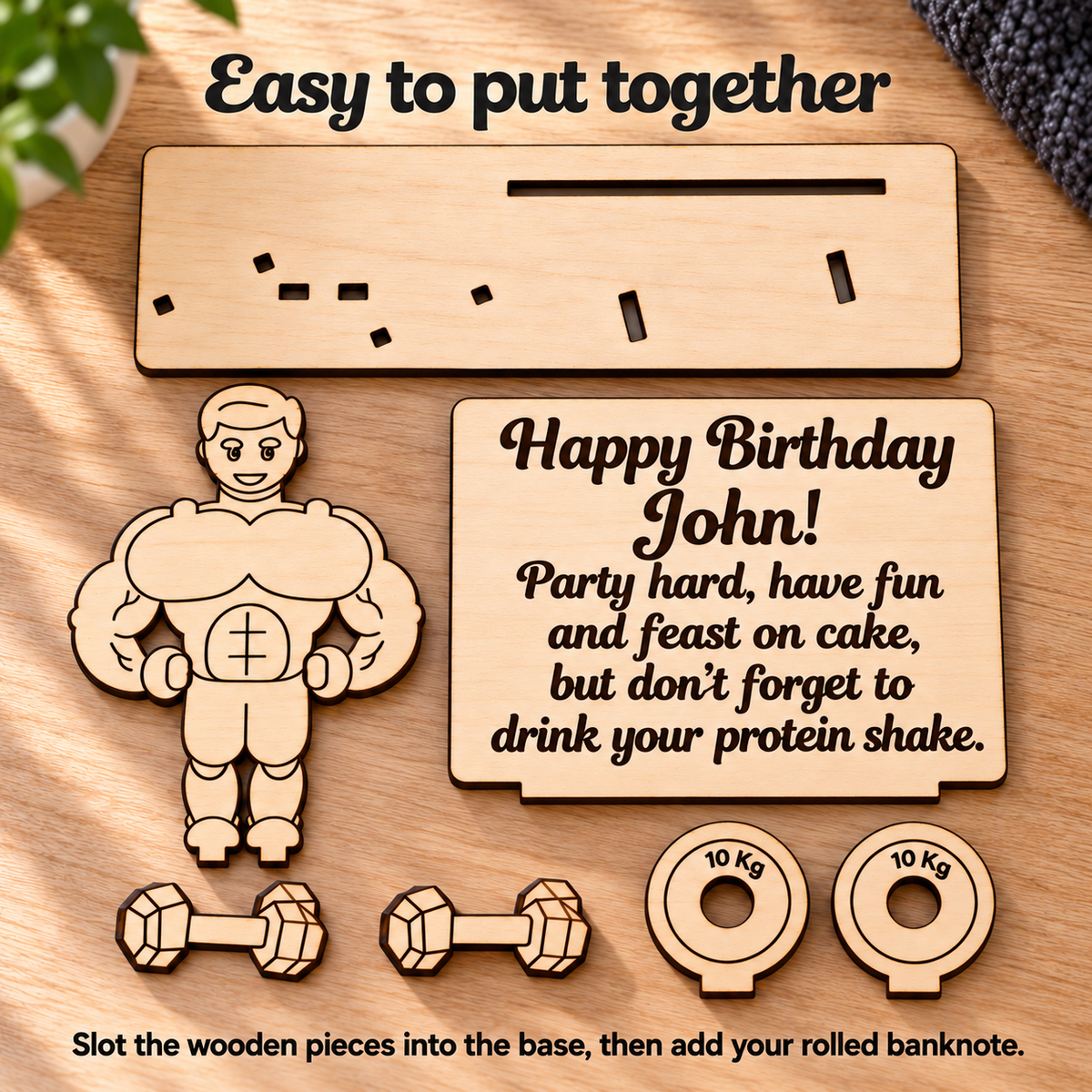 Slot-together wooden gym money holder parts: base, bodybuilder, message panel, dumbbells and weight plates