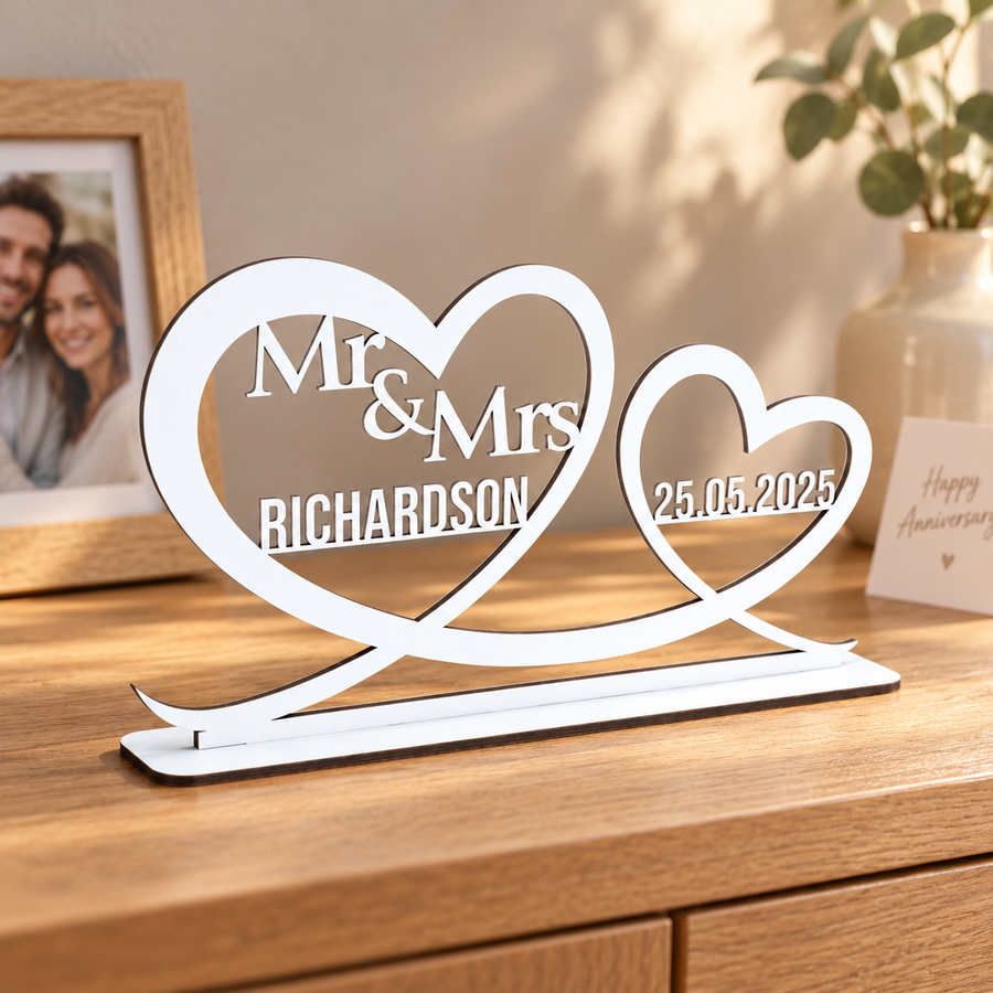 White personalised Mr and Mrs double heart ornament with Richardson surname and wedding date displayed on a wooden sideboard