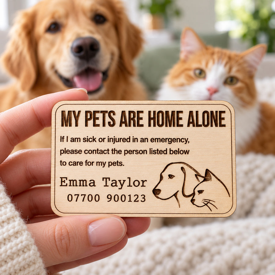 Personalised pet emergency card held in a hand, with a dog and cat at home in the background.