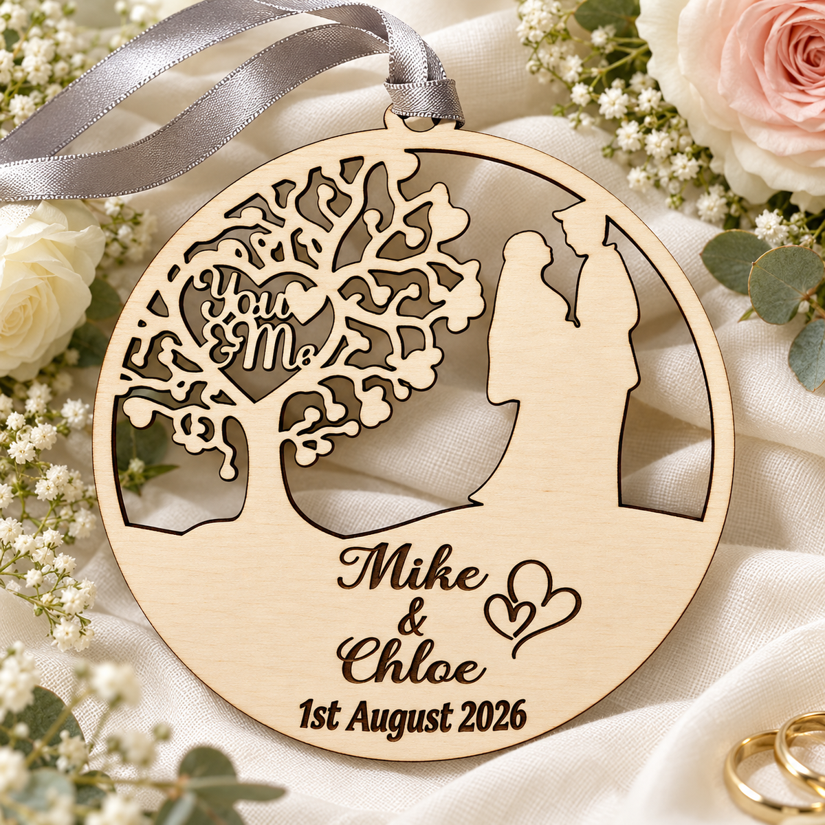 You and Me wooden wedding keepsake on ivory linen with white and blush roses, silver-grey ribbon, engraved Mike and Chloe and their special date.