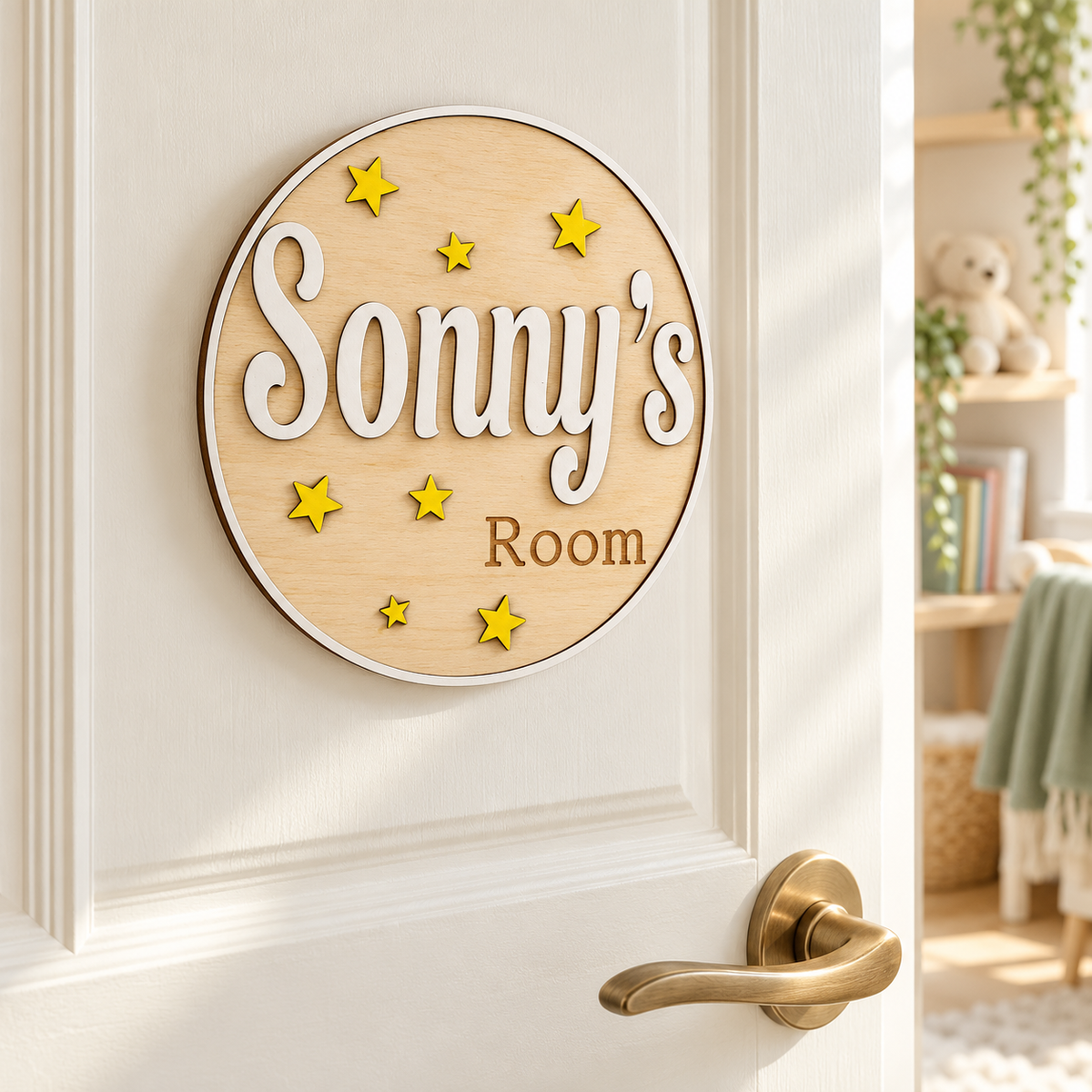 Round personalised 3D wooden name plaque with stars displayed on a child’s bedroom door