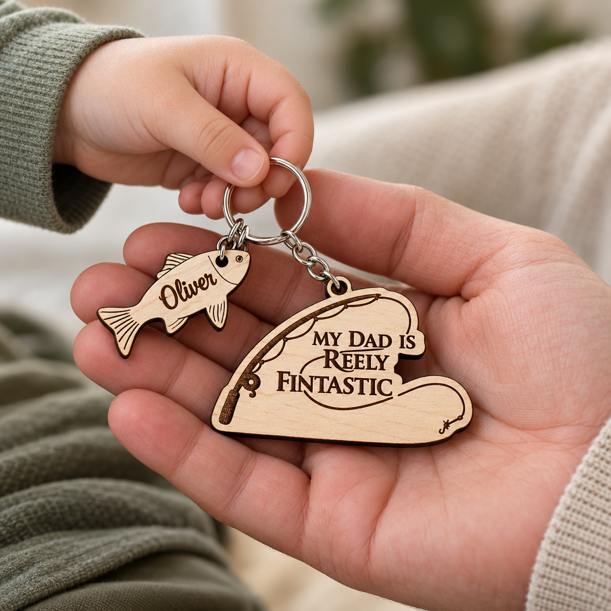 Child giving Dad a My Dad is Reely Fintastic fishing keyring with one fish charm engraved Oliver