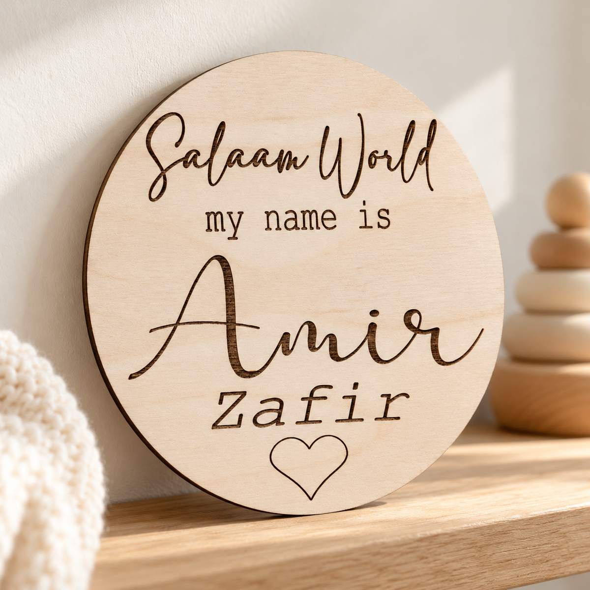 Salaam World engraved baby name plaque displayed as a keepsake on a nursery shelf