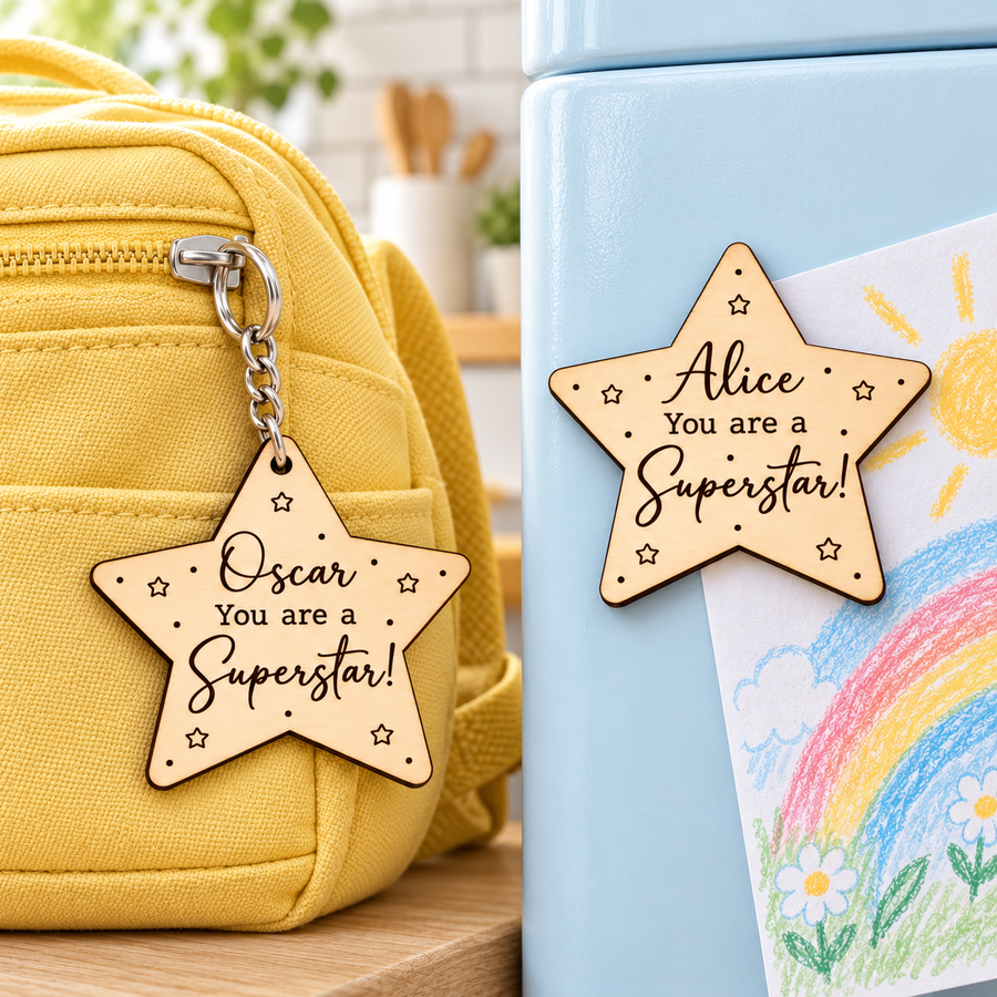 Personalised Superstar keyring on a yellow school backpack beside a matching fridge magnet holding a child's drawing on a blue fridge.